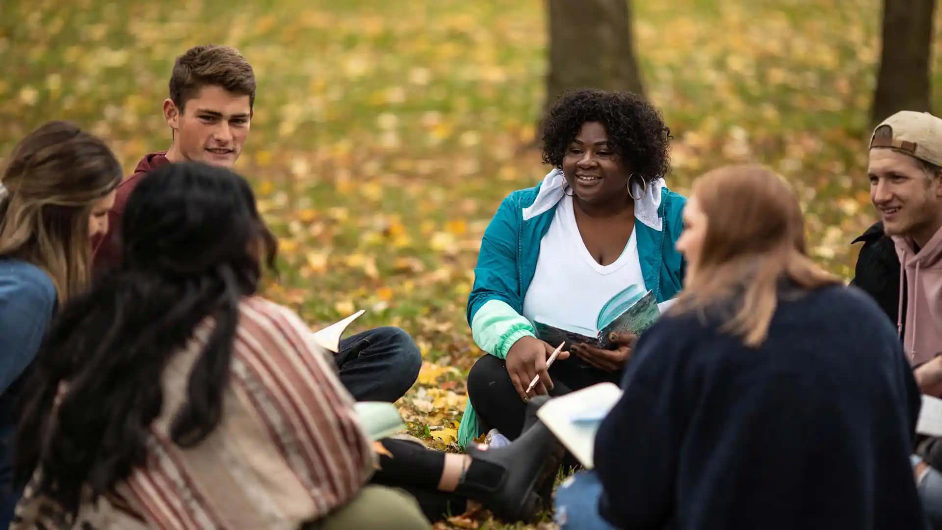 On-Campus-Biblical-Studies2 A group of students reading and discussing the Bible