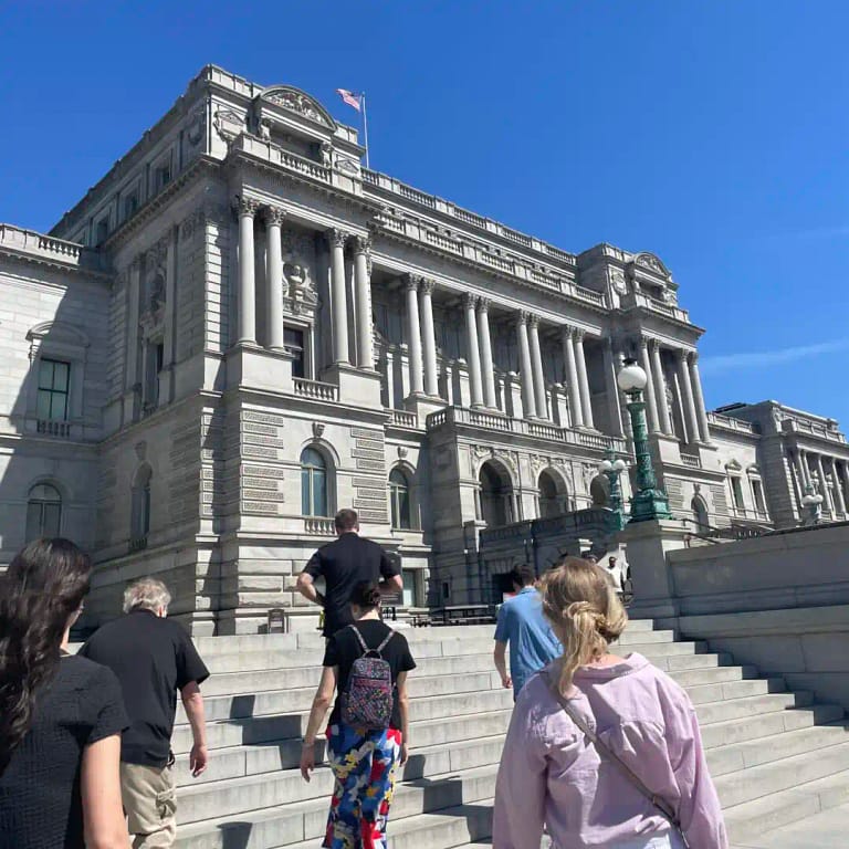 Group Walking Up The Stairs